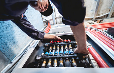HVAC technician servicing home heating and cooling system