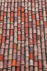 Vertical roof tiles of an old house in a village.