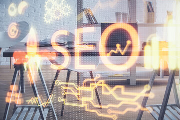 Double exposure of SEO drawing and office interior background. Concept of Search optimization...