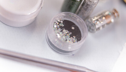 Obraz na płótnie Canvas decorations for nail manicure. diamonds for manicure in beauty salon
