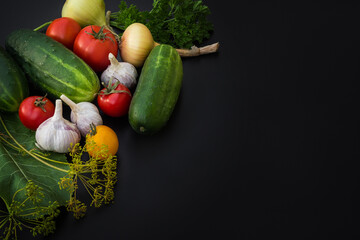 Vegetables on a black background. Healthy eating. Place for text.
