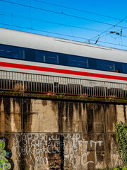 Düsseldorf, Germany, 7 December 2021. Deutsche Bahn Intercity Express train on an elevated track approaching Düsseldorf Central Station in the afternoon sun.