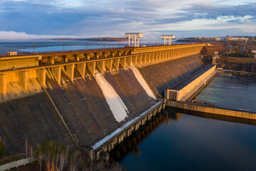 Fototapeta na wymiar The Bratsk Hydroelectric Power Station. A dam on the Angara River and adjacent hydroelectric power station. 
