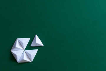 White and green origami background. Different thinking concept
