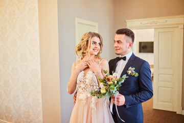 Happy handsome groom entering room