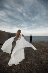 Fashion bride in beautiful wedding dress outdoor