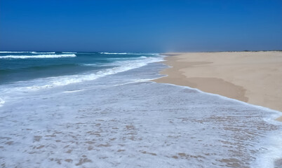 Pristine endless beach praia do Sao Jacinto with long sand banks at the beach in north Portugal