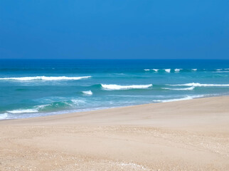 Fototapeta na wymiar Pristine endless beach praia do Sao Jacinto with long sand banks at the beach in north Portugal