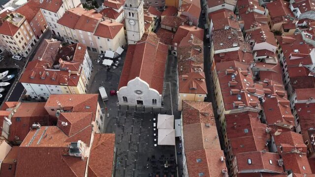 A 4K aerial footage of the Cathedral of Muggia in Italy