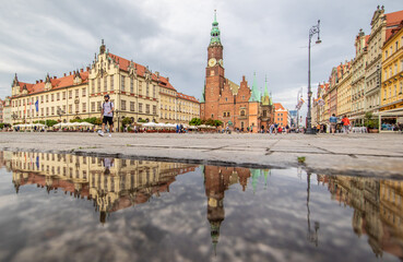 Wroclaw, Poland - due to the frequent rain, in Wroclaw you can easely find water pools, and use them to make nice shots. Here in particular the mirror effect in the Old Town