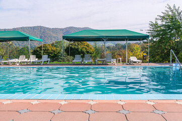 Outdoor swimming pool with mineral water. Thermal volcanic water in the pool