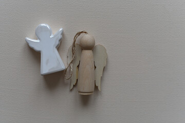 Cute little angel statuette stock images. Christmas background, toys in the form of angels in...