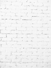 a close up of a old, painted, white brick wall