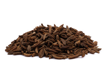 heap of dry brown cumin or caraway seeds isolated on white background