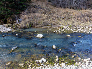 traveling along the bed of a mountain river, an autumn day, nature is preparing for winter hibernation.