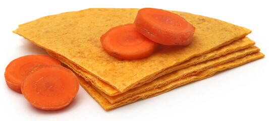 Tortilla made of carrot and flour over white background