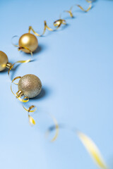 Gold Christmas decorations on a blue background. High quality photo