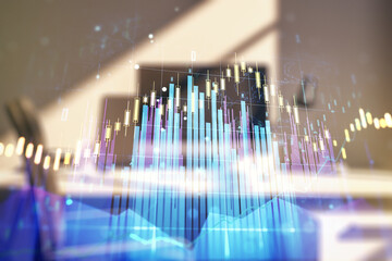 Abstract creative financial graph and modern desktop with computer on background, forex and investment concept. Multiexposure
