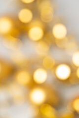 bright magical yellow bokeh on a light background. Without focus.