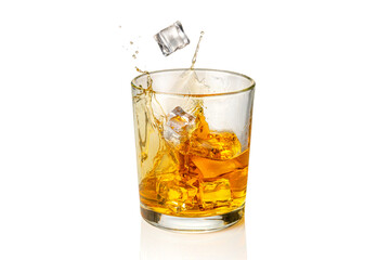 Glass of Whiskey, whisky or bourbon with falling ice cubes with splash, isolated on white