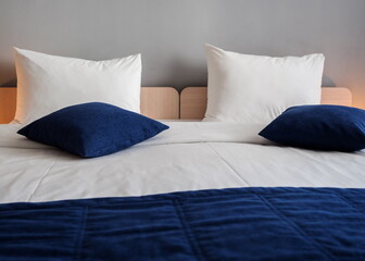 Fototapeta na wymiar Large double bed in Hotel 28 room Rosa Khutor. Russia Sochi 08 04 2019