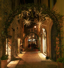 Festive Christmas atmosphere,lights and decorations in the streets of the city center. Como,lombardy, Italy.