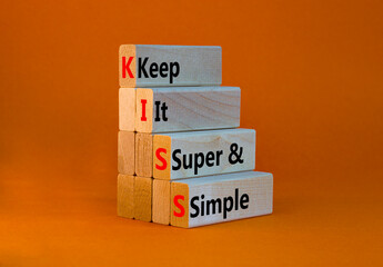 KISS keep it super and simple symbol. Concept words KISS keep it super and simple wooden blocks....