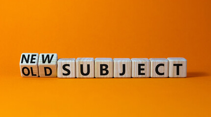 Old or new subject symbol. Turned wooden cubes and changed the word old subject to new subject. Beautiful orange table, orange background. Business, old or new subject concept. Copy space.