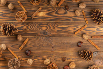 Festive autumn decor of berries and leaves on a dark wooden background. Thanksgiving or Halloween...
