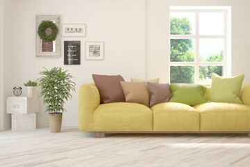 White living room with sofa and summer landscape in window. Scandinavian interior design. 3D illustration