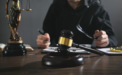 Male judge working in courtroom.