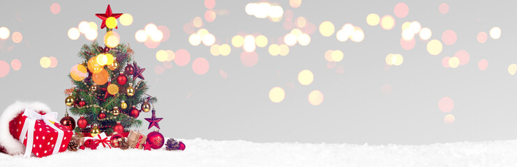 Christmas Tree with decoration on a winter background.