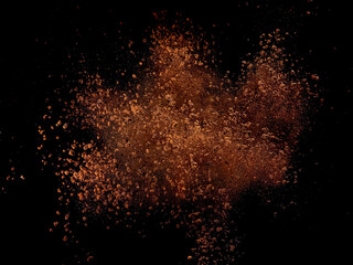 Explosion of dry instant coffee on black background