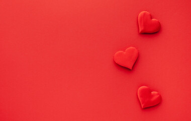 Valentine's day or Wedding romantic concept. Red hearts on red background.Top view, flat lay, copy space.