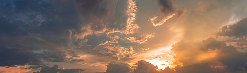 Naklejka premium Beautiful view of sky with clouds at sunrise. Partly cloudy. Colorful sunset. Natural blue sky background texture, beautiful color.