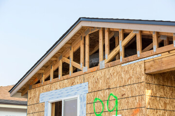 Framed roof on stick construction house in progress