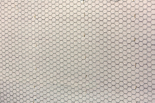 Construction mesh stretched over foam on a wall