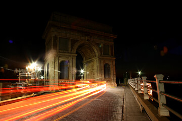 Cars driving over Arch on the dam wall at night with cars driving over in Hartbeespoort in the...