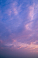 Beautiful view of sky with clouds at sunrise. Partly cloudy. Colorful sunset. Natural blue sky background texture, beautiful color.