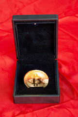 Bitcoin gold coin on red background
