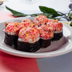 japanese rolls with a cap on a plate