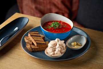 Borsch. Traditional Ukrainian or Russian beetroot and tomato soup with beef meat, potatoes, cabbage. National slavic food