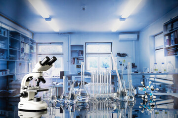 Laboratory investigations concerning test and medicine against covid. Microscope, glass tubes and beakers on blue background.