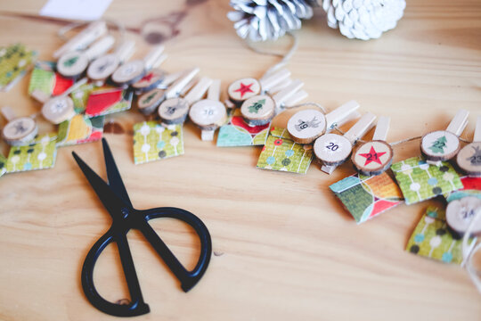 Preparing the handmade advent calendar with surprises and fun plans for children