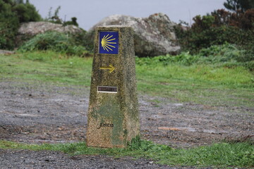 Milestone at Finisterre lighthouse, the end of the St. James Way (Camino de Santiago)