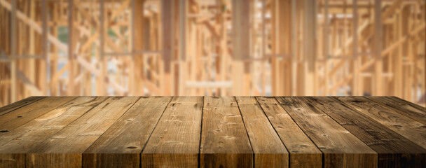 Empty Wood Table Surface Display Background with Construction Theme Behind.