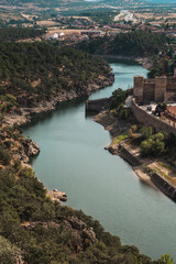 Fototapeta na wymiar Lozoya river around an old wall (Sierra de Madrid, Buitrago del Lozoya, Spain)