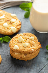 White Chocolate Caramel soft baked cookies served with glass of milk