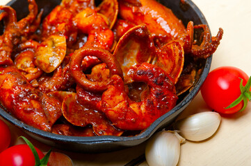 fresh seafoos stew on an iron skillet