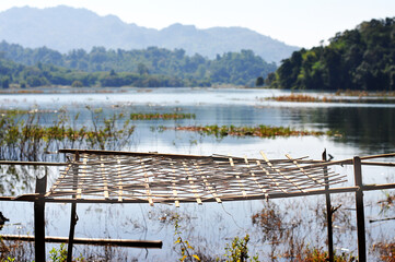 Woven bamboo net for fishermens drying fish rim nature lake